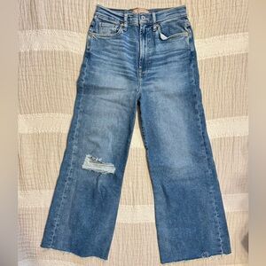 7 For All Mankind Luxe Vintage wide-leg, high-rise jeans with a distressed hem